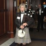 An Irish bagpiper leads the 2011 honorees into the ballroom