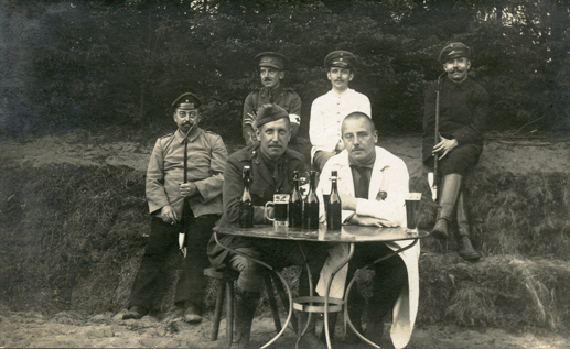 Major Egan, at table (left). Senneglager Prisoner of War Camp, 1915.