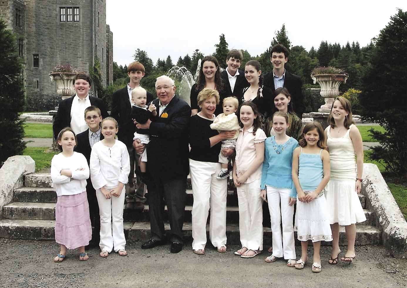 Don and his wife Mickie (center with babies) at Ashford Castle in 2006 with 16 of their 18  grandchildren (two could not make the trip because of school). (Photo courtesy Keough family).