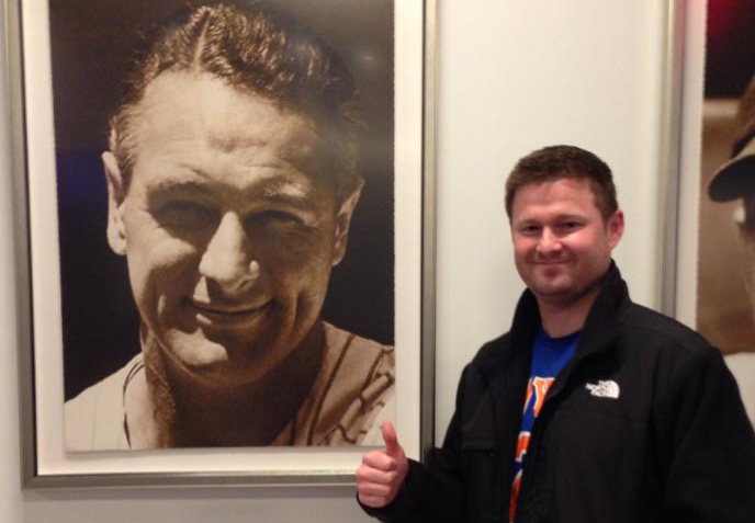 Pat with a photograph of Lou Gehrig. (Photo: Facebook / Quinn 4 the Win)
