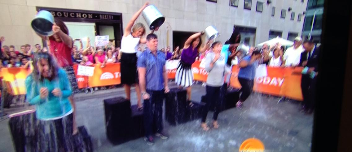 Katie Couric (center) doing the Challenge with the Today Show at Rockefeller Center, August 10, 2014. 
