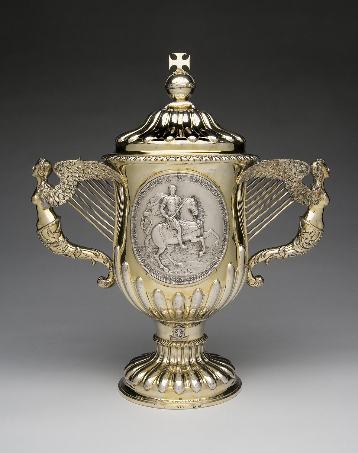 Two Handled Samuel Walker. Silver Cup and Cover, c. 1761 – 1766.  On loan from Philadelphia Museum of Art. Samuel Walker was one of a famous family of  silversmiths from Dublin. The exhibition also  features an extensive collection of Irish silver objects from the San  Antonio Museum of  Art, Texas.