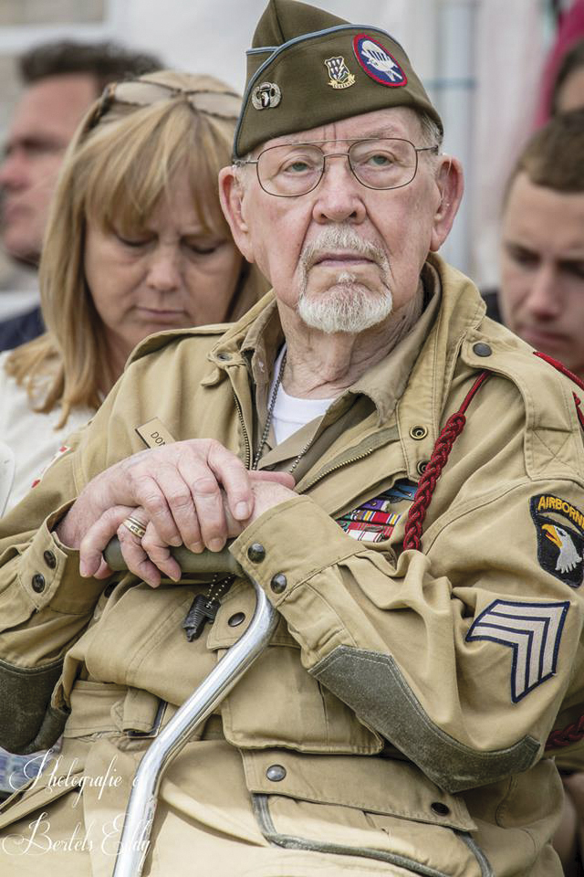 Donald Burgett, one of Ravenoville's liberators, watches the 2014 commemoration events at the Memorial. 