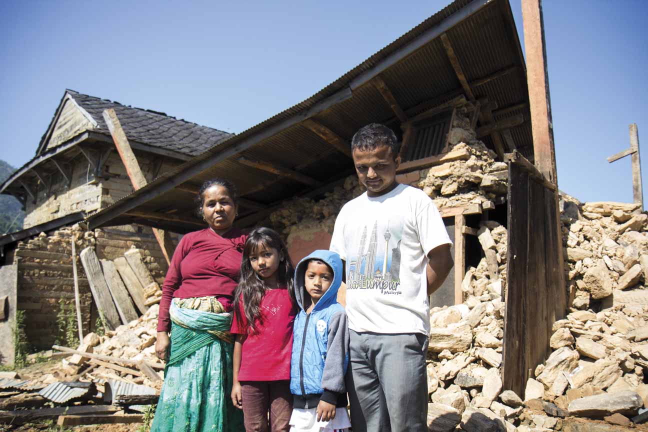 Kamala Neupane, 54, Ayushma Singh, eight, Ayush Singh, five, and Pratap Neupane, 23.  Kamala Neupane lived in the home and was in Bakrang when the earthquake hit. Her husband passed away years ago and her children all live outside of Bakrang, so she spent the hours after the earthquake trying to reach her children. her son, Pratap, is student in Kathmandu and came back to Bakrang to help his mother recover what they can from the rubble.