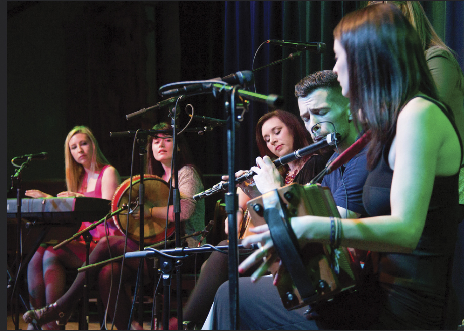 Girsa on stage: Emily McShane, Bernadette Flanagan, Pamela  Geraghty, flute player Sean Tierney, the newest member of the group, and Blaithin Loughran.