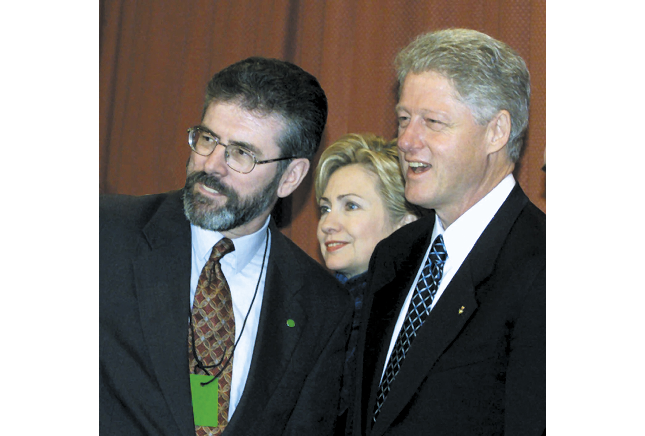 President Clinton and Irish Prime Minister Bertie Ahern, right, talk with Gerry Adams, president of Sinn Fein, left, at a reception at the Guinness brewery in Dublin. Clinton is on the first day of a three-day visit. First lady Hillary Rodham Clinton is standing in the background. (AP Photo/Ron Edmonds)