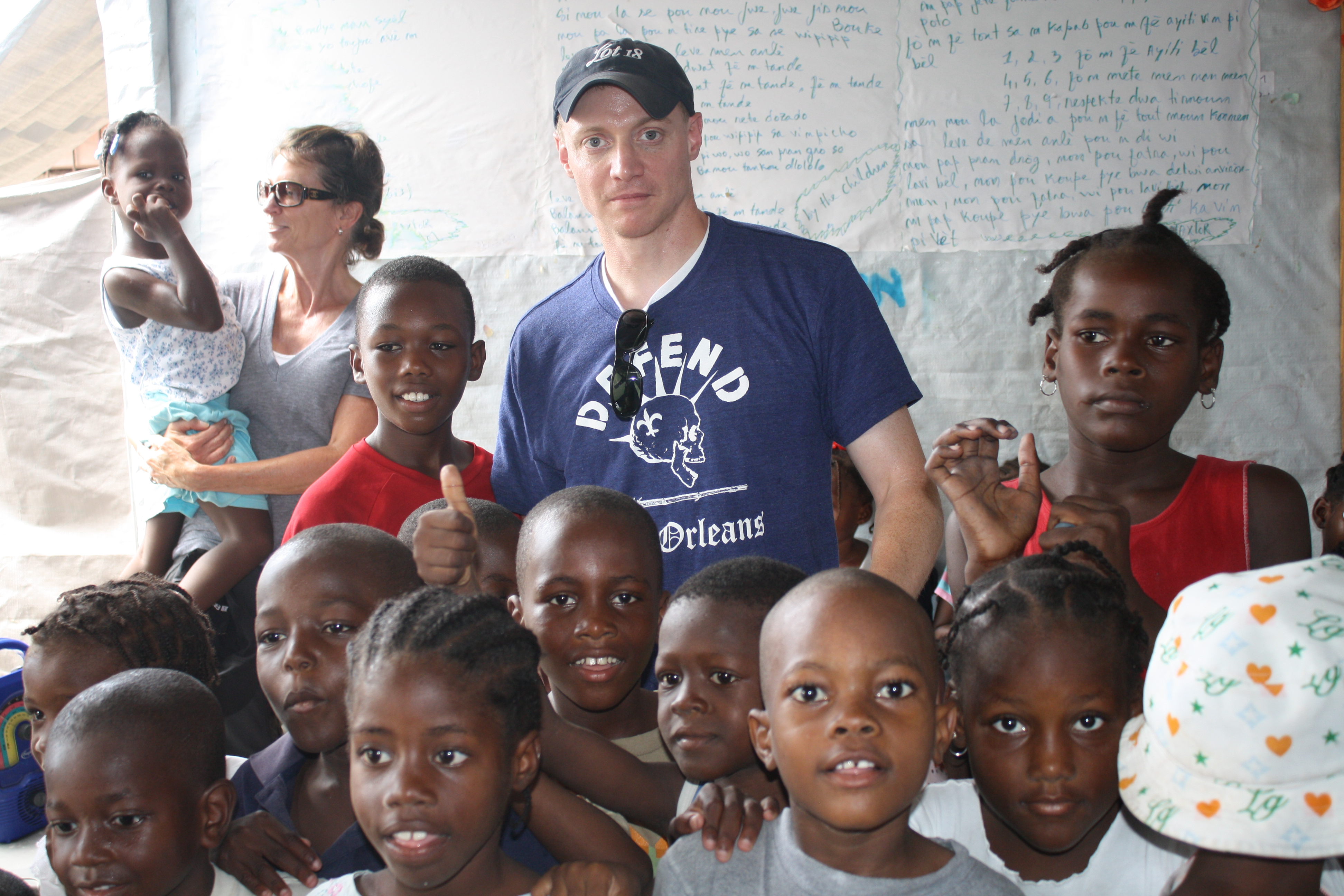Fortuna, center in hat, visiting Concern's relief efforts in Haiti. (Courtesy Kevin Fortuna)