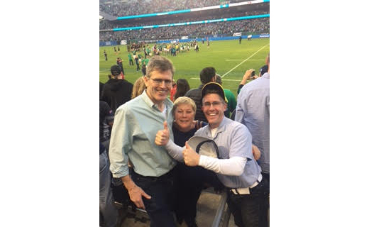 Wall Street 50 honoree Martin Kehoe with his wife Mary and Healthcare 50 honoree Neil Kelleher at the Ireland – New Zealand game at Soldier Field
