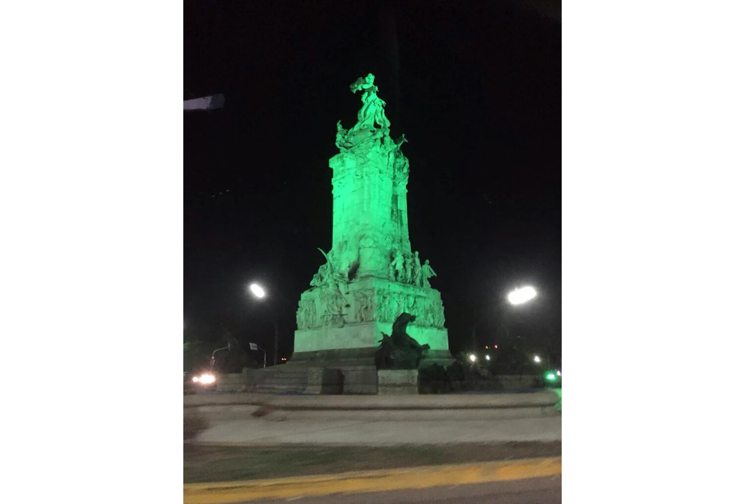 The Spanish Monument in Buenos Aires, raised in 1910 for the  centennial of Argentina’s Revolution of May, illuminated green for Ireland’s own centenary.