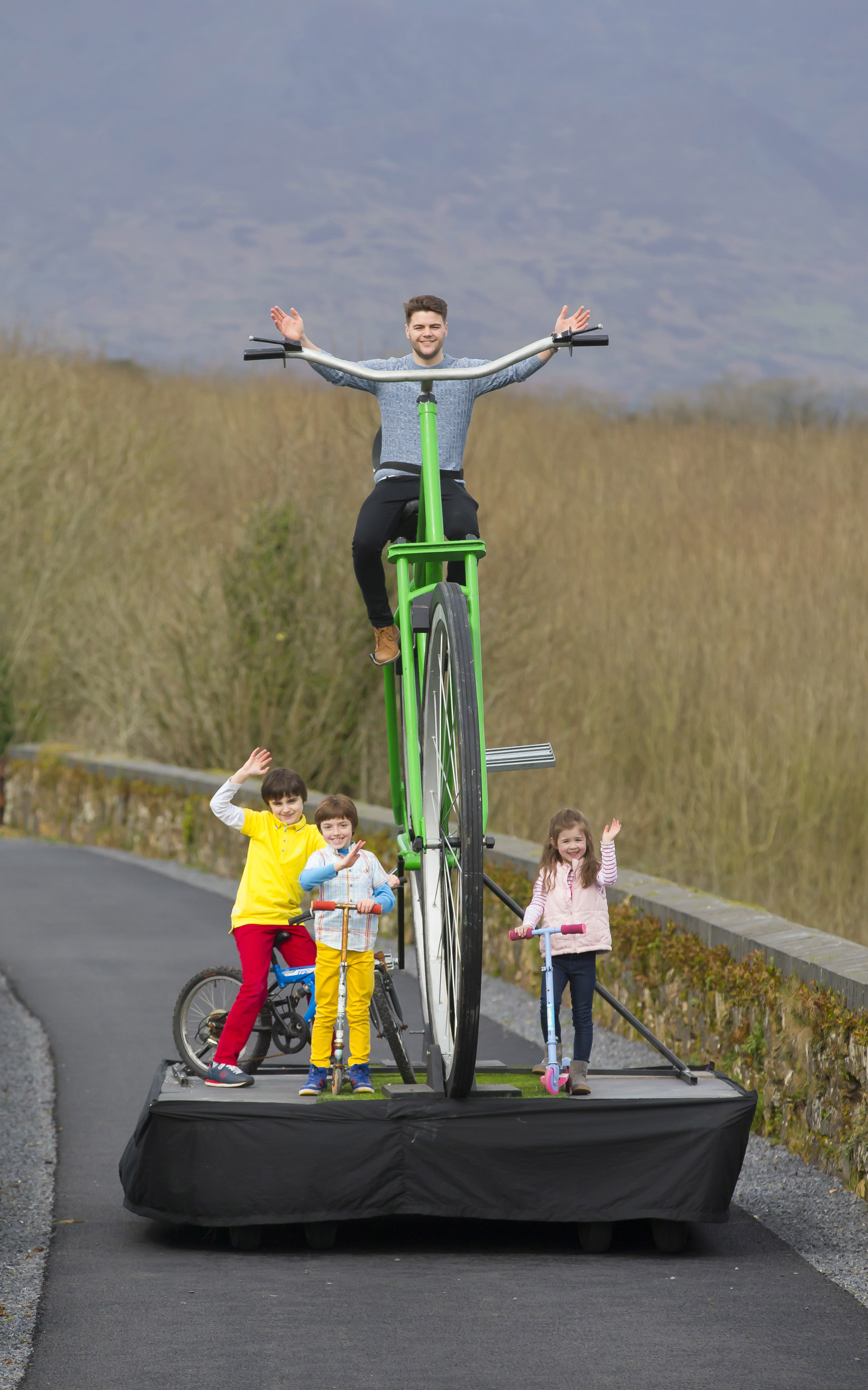 Pictured on the Waterford Greenway is Mayor of Waterford, Cllr Adam Wyse on a giant bicycle created by street arts company Buí Bolg along with Joshua Moran-Davy (10), Reuben Moran-Davy (7) and Leah Moran-Saunders (5) from Passage East, Co Waterford. (Picture: Patrick Browne)