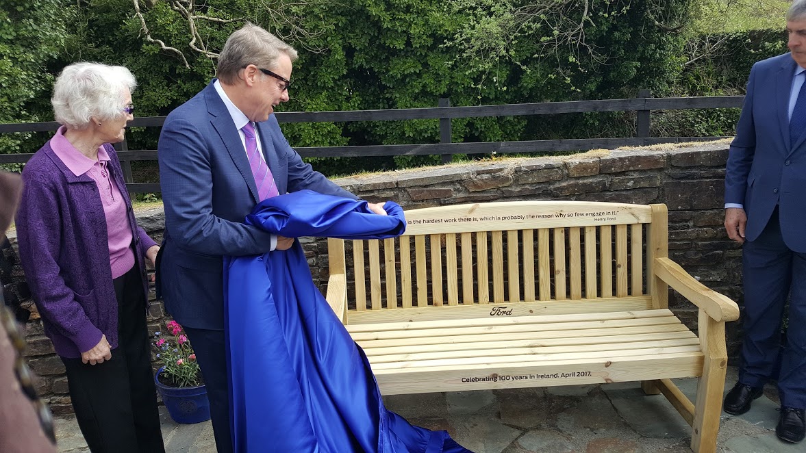 Bill Ford and distant relative Hazel Ford Buttimer reveal the commemorative bench.