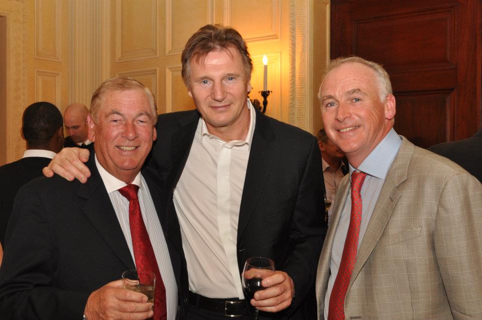 Liam Neeson (center) attends the 2012 tournament. John Fitzpatrick is pictured at right.