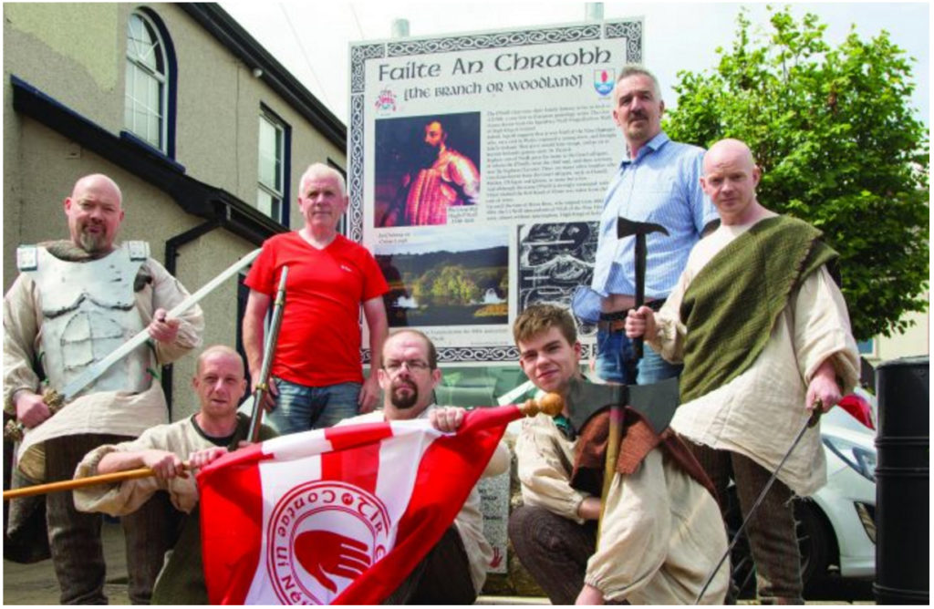 Members of  the local historical  reenactment group  with Dan O'Neill, chief guardian of the Ancient Clan of O'Neill in  Ulster, and the chairman of Stewartstown  Community Group Johnny Rushe, who  unveiled a memorial stone and plaque for  the 400th anniversary  of the death of Hugh O'Neill in The Square, Stewartstown.