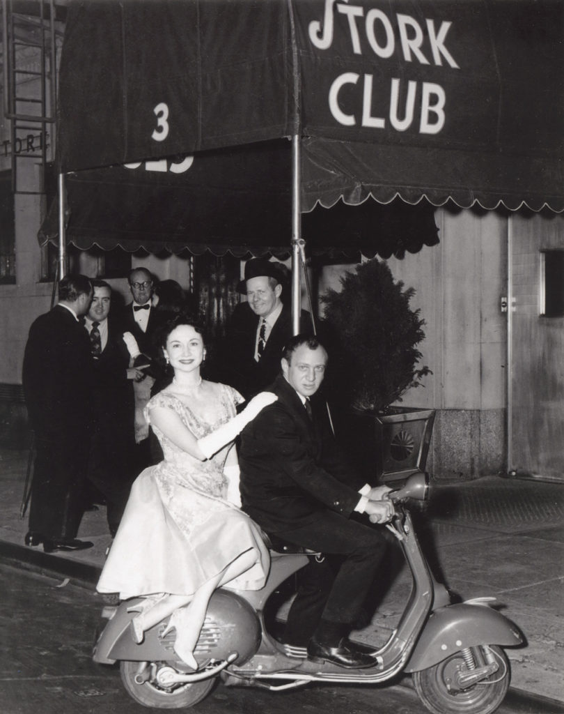 Dorothy and pal on a scooter outside the Stork Club.