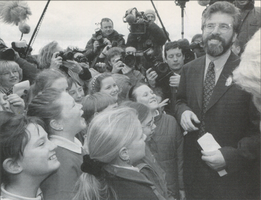 Sinn Féin president Gerry Adams welcomes schoolchildren from Co. Down to Stormont's Castle Buildings on the final day of the multi-party peace talks.