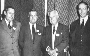 A fleet of Morans at the helm of Moran Towing and Transportation Company in the 1940s. From left: Eugene F. Moran, Jr., vice president in charge of contracts; Real admiral Edmond J. Moran, U.S.N.R., president; Eugene F. Moran, Sr., chairman of the board; Joseph H. Moran II, vice president in charge of operations.