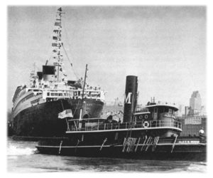 Moran tugs carefully guide the Queen Mary into her berth after her first voyage across the Atlantic in 1936.