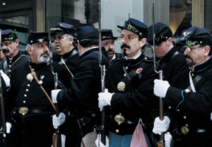 The Irish Brigade reenactors lining up outside Grand Central Station, put on their gloves and get ready to join The St. Patrick's Day Parade.