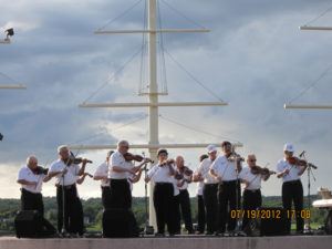 Fiddlers on the banks of the Miramichi. Photo: John Kernaghan.