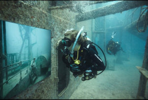 Divers tour Andreas Franke's exhibition "The Sinking World" in the USS Vandenberg. Photo: Andreas Franke.