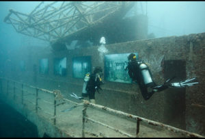 Divers explore Andreas Franke's exhibition "The Sinking World" in the USS Vandenberg. Photo: Andreas Franke.