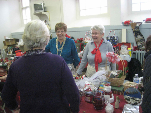 The annual Christmas Bazaar at St. Gabriel’s Church. Katie Deegan is pictured on the left and her friend Pat Schell, with the red bow, is on the right. The Bazaar raised $15,000.