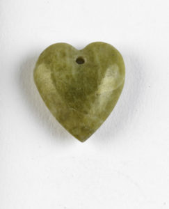 A small heart-shaped Connemara marble charm carried by an Irish soldier  (EPH 4895). © IWM