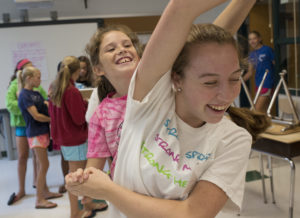 (R-L) Girls Up Teen Board member Liza Johnston (front) plays with Maeve Murray during the break at Girls Up summer camp on Wednesday, July 23, 2014 in Chevy Chase. (Photo by Yue Wu/The Washington Post)