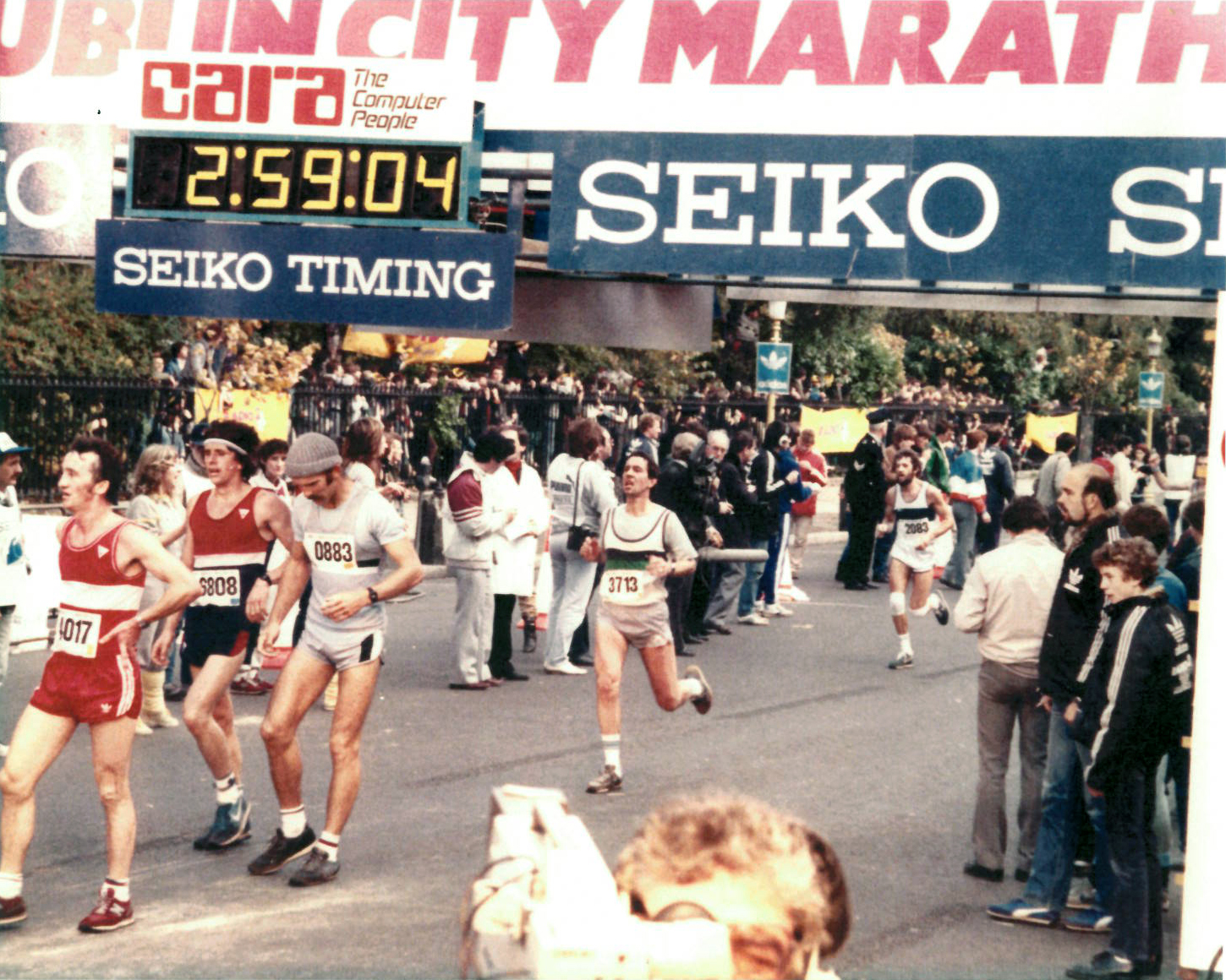 Clerkin (center, #3713) at the finish line of the 1983 Dublin Marathon. He finished with a sub-three-hour time after four friendly bets. 