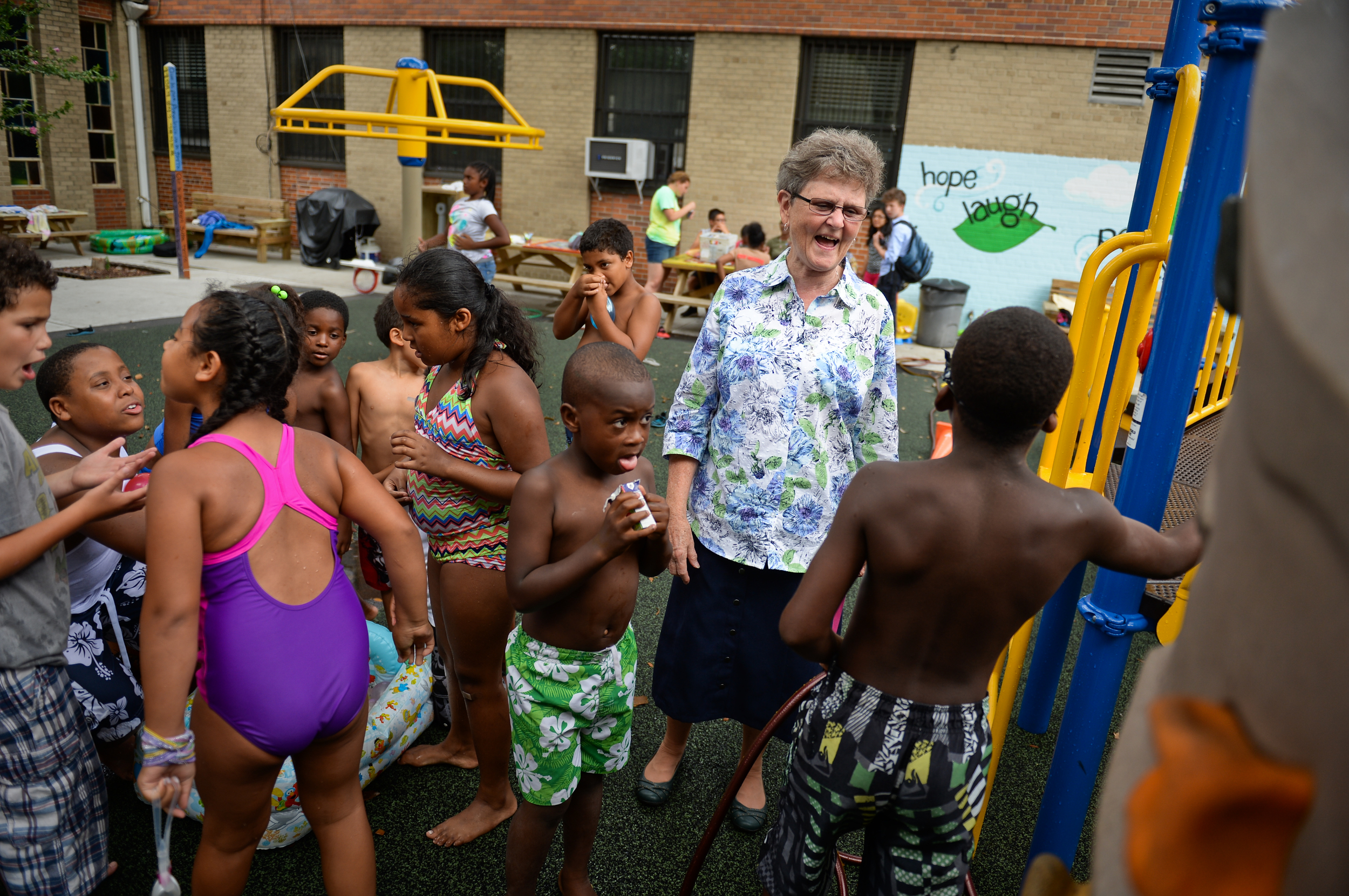 Sister Tesa with children at the Hour Summer Camp and After School Program in Long Island City.