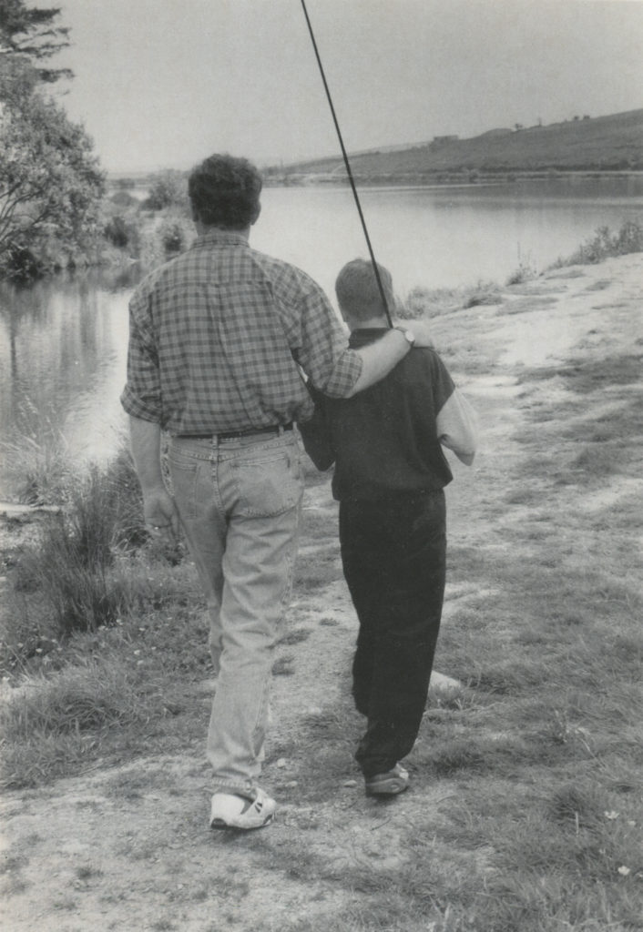 Martin McGuinness, then vice-president of Sinn Féin, with son fly-fishing, photographed by David Spielman for Irish America in the fall of 1995. Spielman wrote at the time, “I had read that Martin McGuinness was an avid fisherman who pictures himself on a sea trout farm in the west of Ireland when the Troubles are all over. When I mentioned this to him he invited me to go fishing with him and he brought along his son. We spent several hours together fly-fishing the reservoir north of Derry.”