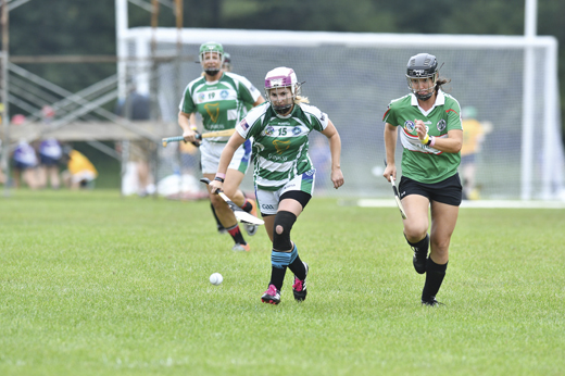 <em>Captain Heather Warren of Coastal Virginia Camogie focuses on winning the ball before a Seattle Gaels camog does.</em>