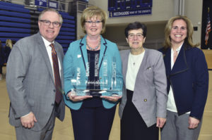 Eileen accepted the 2017-2018 Neumann University Institute for Sport, Spirituality and Character Development Award. Pictured: Dr. Chris Domes (President of Neumann University); Eileen McDonnell; County Sligo native Sr. Marguerite O’Beirne, OSF (VP for Mission and Ministry); and Lee Delle Monache (Director of Neumann’s Institute).