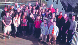 John Dearie pictured with his sister, Eileen (fourth from right), her seven children and their spouses, and 20 grandchildren.