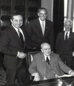 Albany introduces Dearie’s bill, the MacBride Principles, signed into law later that year by Gov. Mario Cuomo (first in the nation). Clockwise from left: Gov. Cuomo, John Dearie, Paul O’Dwyer, and Sean MacBride. 1986.