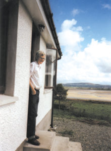 Paddy on the steps of his home overlooking the Isle of Doagh.