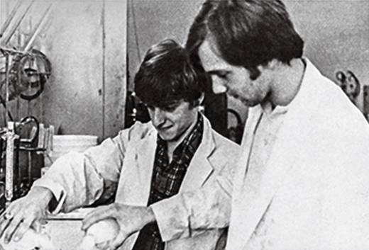 Dr. Tracey, left, in an early lab setting at Boston College in 1979.