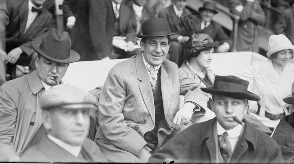 Boxer Jim Corbett (center) and Blossom Seeley (wife of Rube Marquard) at Game One of the 1913 World Series at the Polo Grounds New York.
