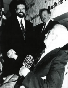 February 1994. Sheraton Hotel, New York. Gerry Adams on his first trip to the U.S. is introduced by Paul O'Dwyer (seated) with congressman Bruce Morrison in the background.