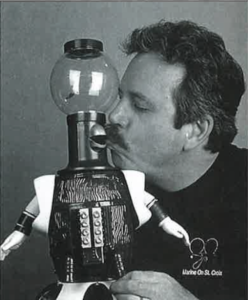 Kevin Wagner Murphy, voice of "Tom Servo" on Mystery Science Theater 3000, gives a silly kiss to the TV robot. 